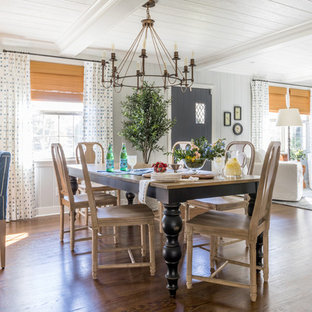 Inspiration for a country medium tone wood floor and brown floor dining room remodel in Jacksonville with gray walls