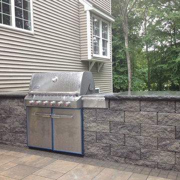 Outdoor grill enclosure