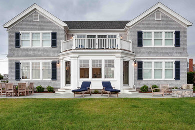 Inspiration for a coastal gray two-story wood and shingle house exterior remodel in Boston