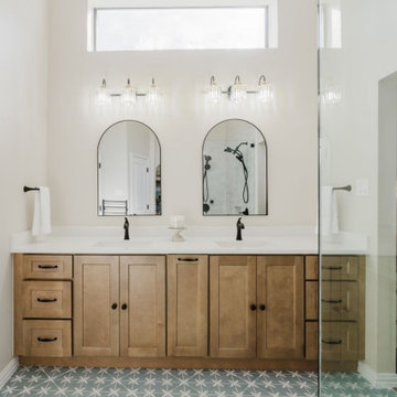 Double Vanity with Arched Mirrors and Custom Lighting