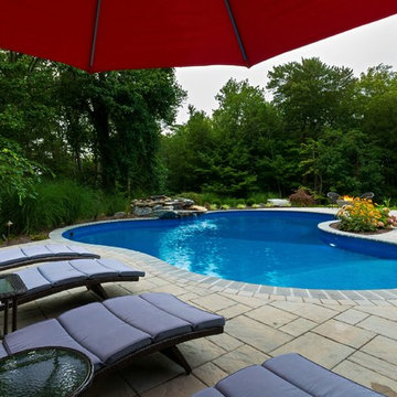 Vinyl pool with Waterfall, Landscape Lighting and Landscaping