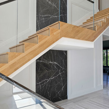 Project #107 | Freestanding Staircase with Marble Backdrop