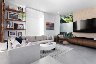 Living room - mid-sized contemporary formal and enclosed gray floor living room idea in Los Angeles with white walls and a wall-mounted tv