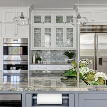 A Light Filled White Kitchen with Seafoam Accents