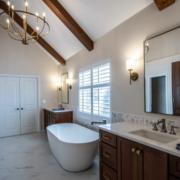 Luxury Spa Bathroom with Natural Warm Vanities, Quartz Countertop, Tiled Shower