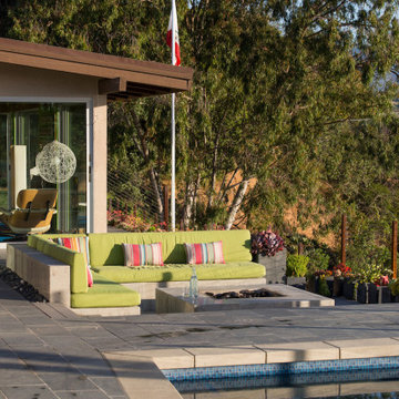 Sunken seating area with built in seating and concrete fire pit