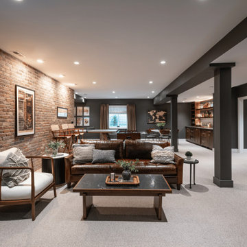 Open-Concept Finished Basement with Central Seating Area & Bar View