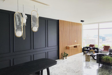 Example of a danish wall paneling dining room design in Other with black walls