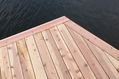 Example of a large trendy backyard dock design in Seattle with no cover