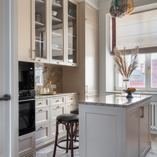 Design ideas for a mid-sized transitional galley separate kitchen in Moscow with an undermount sink, raised-panel cabinets, beige cabinets, granite benchtops, beige splashback, granite splashback, stainless steel appliances, ceramic floors, with island, beige floor and beige benchtop.
