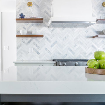 A Bold, Minimal Kitchen With Asian Statuary Herringbone Tile