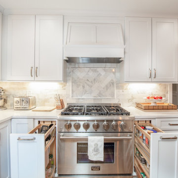 The pullout cabinets hold spices and utensils.