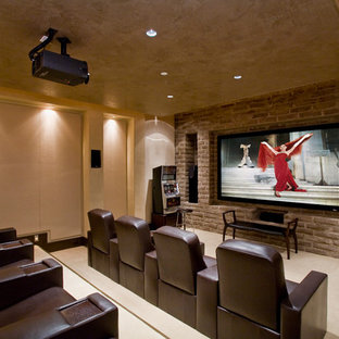 Traditional home cinema in Phoenix with beige walls, carpet, beige floors and a projector screen.