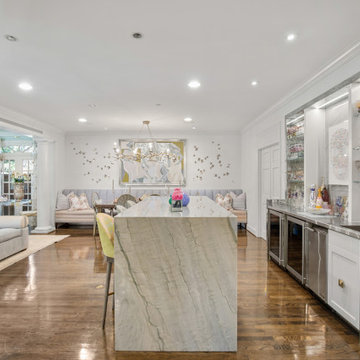 Luxurious Open-Concept Living Space with Marble Island and Elegant Bar Area