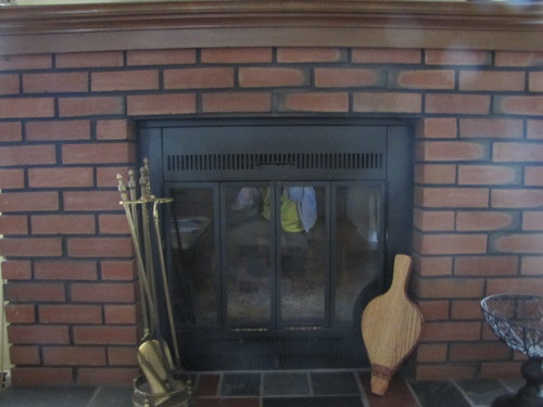 Painting red brick fireplace