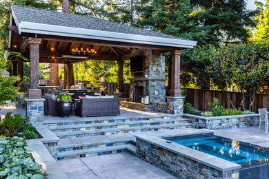 Design ideas for a rustic back patio in San Francisco with an outdoor kitchen and a pergola.