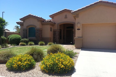 This is an example of a one-storey beige exterior in Phoenix.