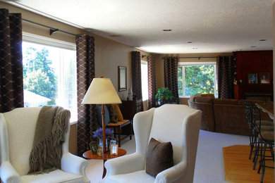 This is an example of a transitional family room in Portland.
