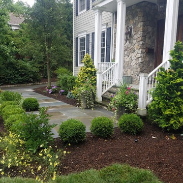 Patio with stone wall and fire pit
