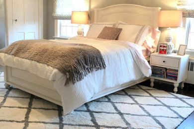 Bedroom - mid-sized transitional dark wood floor and brown floor bedroom idea in New York with gray walls