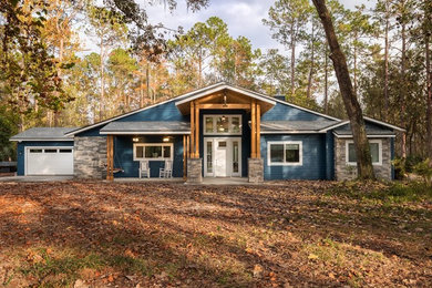 Mid-sized craftsman blue one-story mixed siding exterior home idea in Miami with a shingle roof