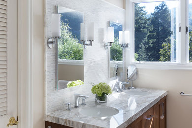 Design ideas for a mid-sized contemporary master bathroom in San Francisco with shaker cabinets, dark wood cabinets, beige walls, an undermount sink and marble benchtops.