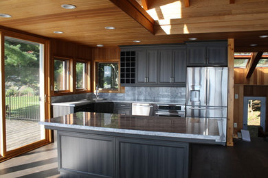 Kitchen - mid-sized transitional l-shaped dark wood floor kitchen idea in Toronto with an undermount sink, recessed-panel cabinets, gray cabinets, marble countertops, stone slab backsplash, stainless steel appliances and an island