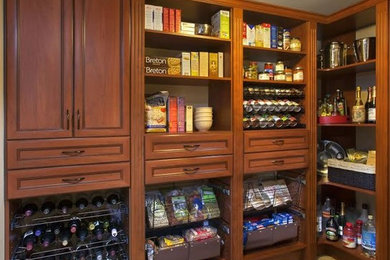 Example of a large classic cement tile floor and beige floor kitchen pantry design in Philadelphia with medium tone wood cabinets, recessed-panel cabinets and no island