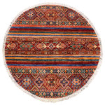 Bareens Designer Rugs - Southwestern Khurgeen Lashawn Red/Blue Wool Round - 3'3'' x 3'4'' - Designed with a mesmerizing intricate transitional and geometric motif this glorious hand knotted rug made with handspun Ghazni wool is a masterpiece that will fill any space with sophistication and grace. Hand knotted by skilled artisans in an exhilarating color pallet with an elaborate design, this masterpiece features luxurious hand spun wool with all vegetable dyes to add comfort and style to your decor. The design, color, and beautiful chromatic composition with a sheen in transitional and geometric designs, exude beauty, elegance and quality make this rug an extraordinarily opulent center piece for your living space. The intricate designs known as Khurgeen, Khorgeen or Khorjin range are inspired by the patterns from ancient tribal bags. An infusion of bold, saturated color gives this traditional hand-knotted rug a fresh perspective and modern appeal. Most desired due to its versatility in design and affordability this handmade rug is in a compelling focal point in any living area.