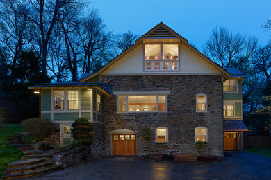 Example of a large cottage green two-story mixed siding gable roof design in Philadelphia