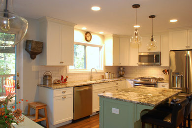 Inspiration for a mid-sized farmhouse l-shaped medium tone wood floor eat-in kitchen remodel in DC Metro with an undermount sink, flat-panel cabinets, white cabinets, granite countertops, white backsplash, ceramic backsplash, stainless steel appliances and an island