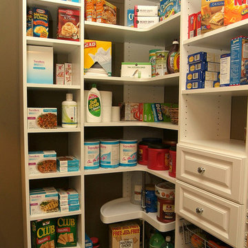 Corner pantry with cabinets and bins