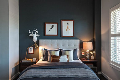 Design ideas for a transitional bedroom in Chicago with black walls and dark hardwood floors.