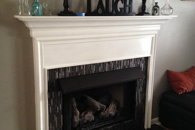 Family room photo in Nashville with a standard fireplace and a tile fireplace