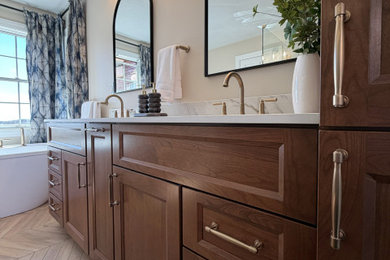 Mid-sized transitional master white tile and porcelain tile porcelain tile, brown floor and double-sink bathroom photo in Other with flat-panel cabinets, dark wood cabinets, a two-piece toilet, beige walls, an undermount sink, quartz countertops, a hinged shower door, white countertops, a niche and a built-in vanity