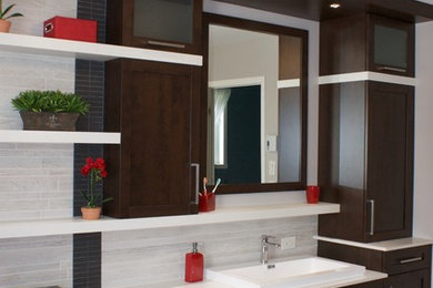 Bathroom - mid-sized contemporary master gray tile and porcelain tile porcelain tile and gray floor bathroom idea in Other with shaker cabinets, brown cabinets, gray walls, a drop-in sink and quartz countertops