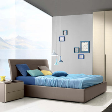 Daisy upholstered bed with curved headboard by Confort Line