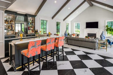 Example of a huge transitional galley porcelain tile and black floor seated home bar design in Providence with an undermount sink, shaker cabinets, gray cabinets, quartzite countertops, mirror backsplash and white countertops
