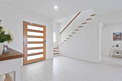 Photo of a contemporary entryway in Sunshine Coast.