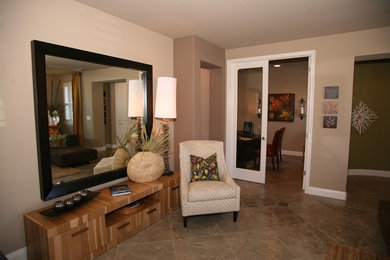 Family room - large transitional ceramic tile family room idea in Sacramento with beige walls