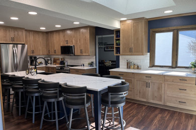 Example of a large trendy l-shaped eat-in kitchen design in Other with shaker cabinets, quartz countertops, white backsplash, subway tile backsplash and an island
