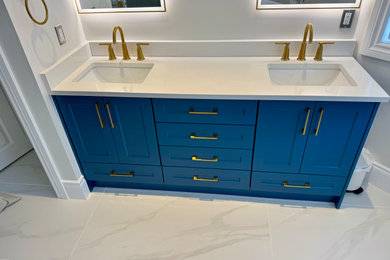 Example of a large trendy master white tile and ceramic tile ceramic tile, gray floor and double-sink freestanding bathtub design in Toronto with shaker cabinets, blue cabinets, white walls, an undermount sink, quartz countertops, white countertops and a freestanding vanity