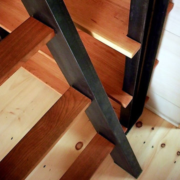 Cherry and steel stairs and bookcase