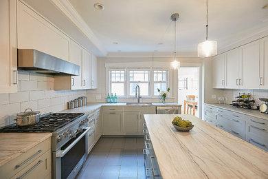 Eat-in kitchen - mediterranean galley eat-in kitchen idea in Minneapolis with an island