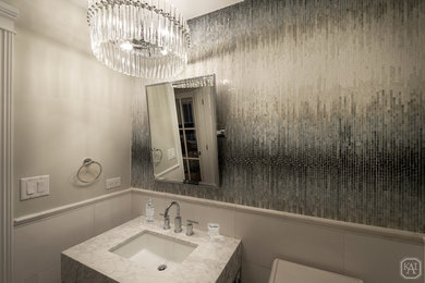 Example of a small transitional multicolored tile and mosaic tile marble floor and multicolored floor powder room design in Chicago with open cabinets, a two-piece toilet, gray walls, a pedestal sink, marble countertops and white countertops