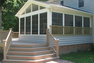 Large elegant backyard deck photo in Other with no cover