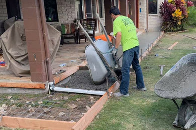 Design ideas for a full sun backyard concrete paver formal garden in Hawaii.