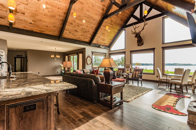 Family room - large rustic family room idea in Other