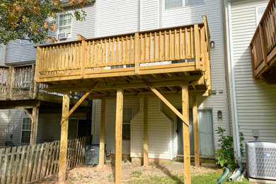 Example of a small classic backyard second story wood railing deck design in Baltimore
