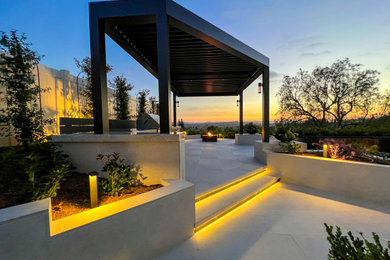 Inspiration for a modern full sun concrete paver landscaping in Orange County.